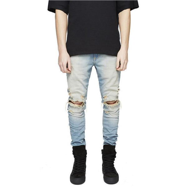 Distressed washed jeans